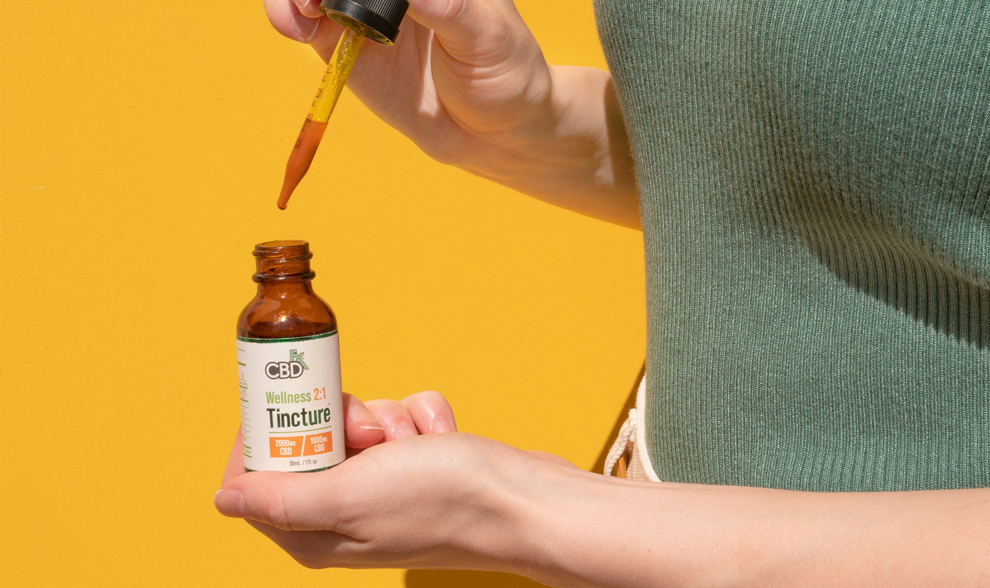 A woman taking CBD oil