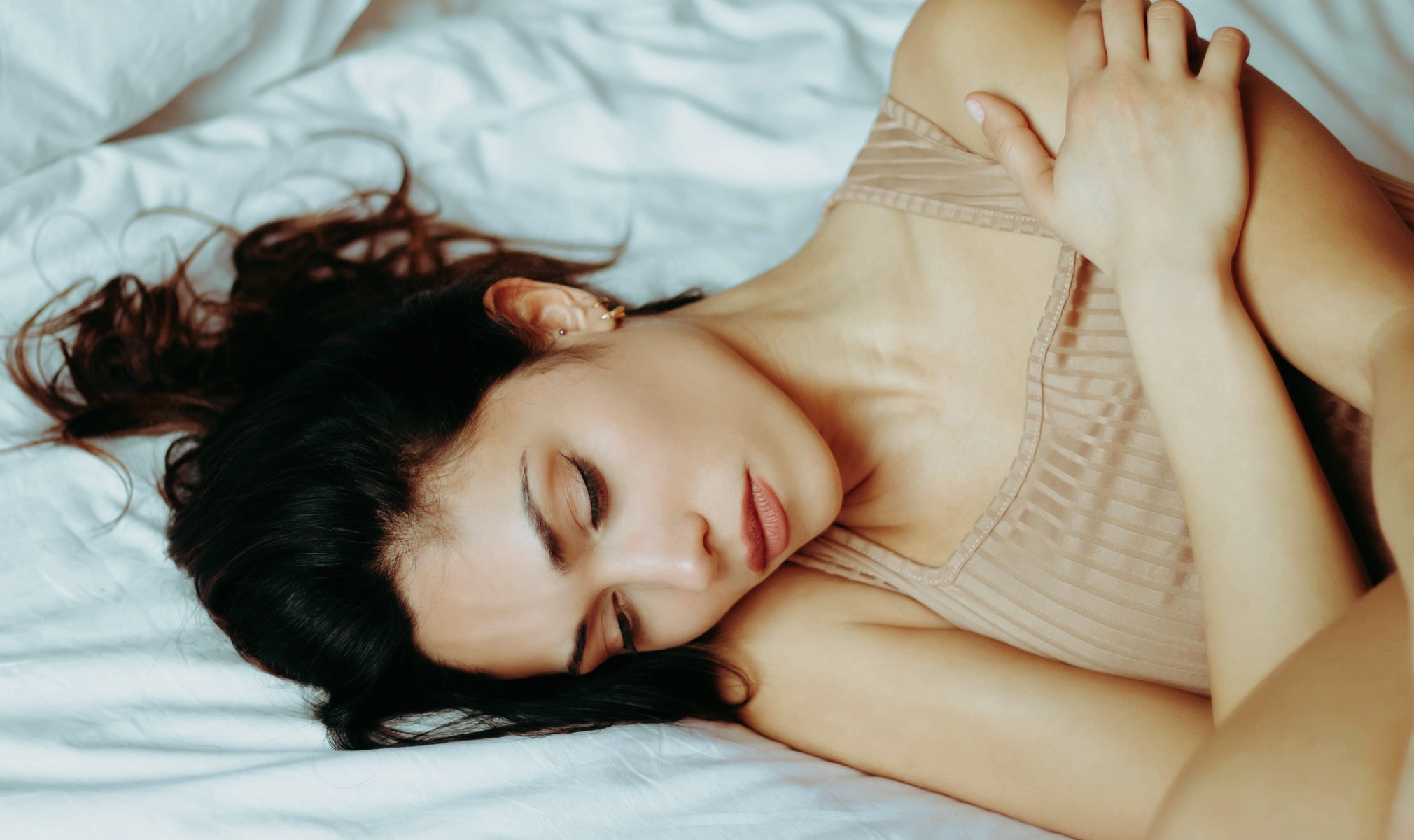 A woman lying in her bed